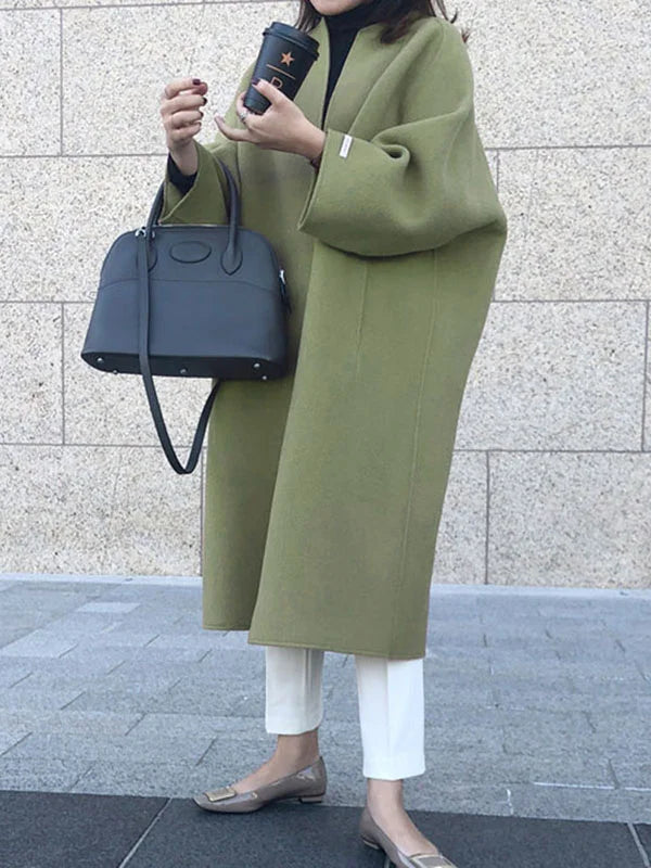 Sophisticated navy long winter coat for women, ensuring warmth & a polished elegant appearance.