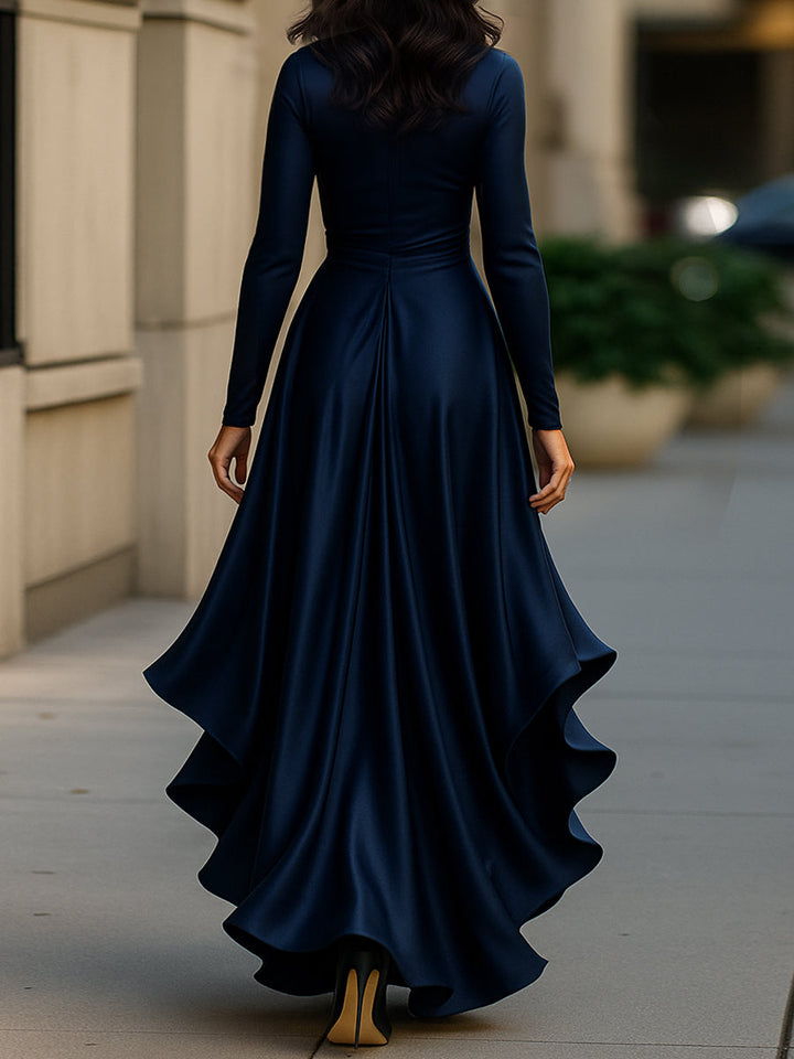 Women's V-neck maxi dress with cascading ruffles, elegant pleats, and long sleeves for evening wear.