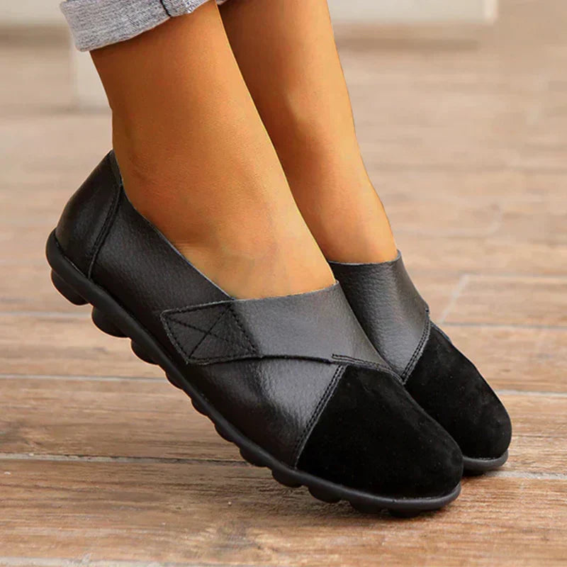 Unisex stitched paneled round toe flat slip-on shoes for casual everyday comfort and walking.