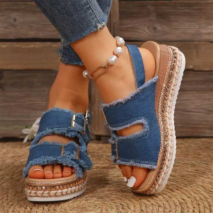 Casual women's denim wedge sandals with a comfortable platform sole, perfect for summer fashion.