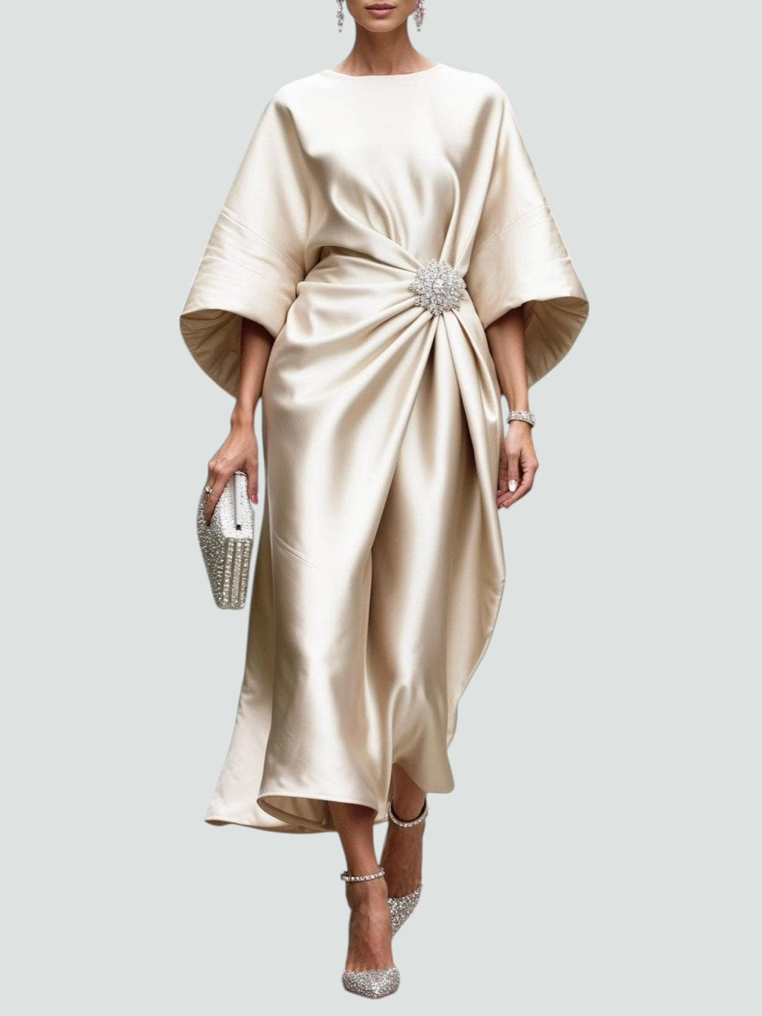 Luxurious women's elegant midi dress, styled with flowing kimono sleeves and an exquisite crystal brooch.