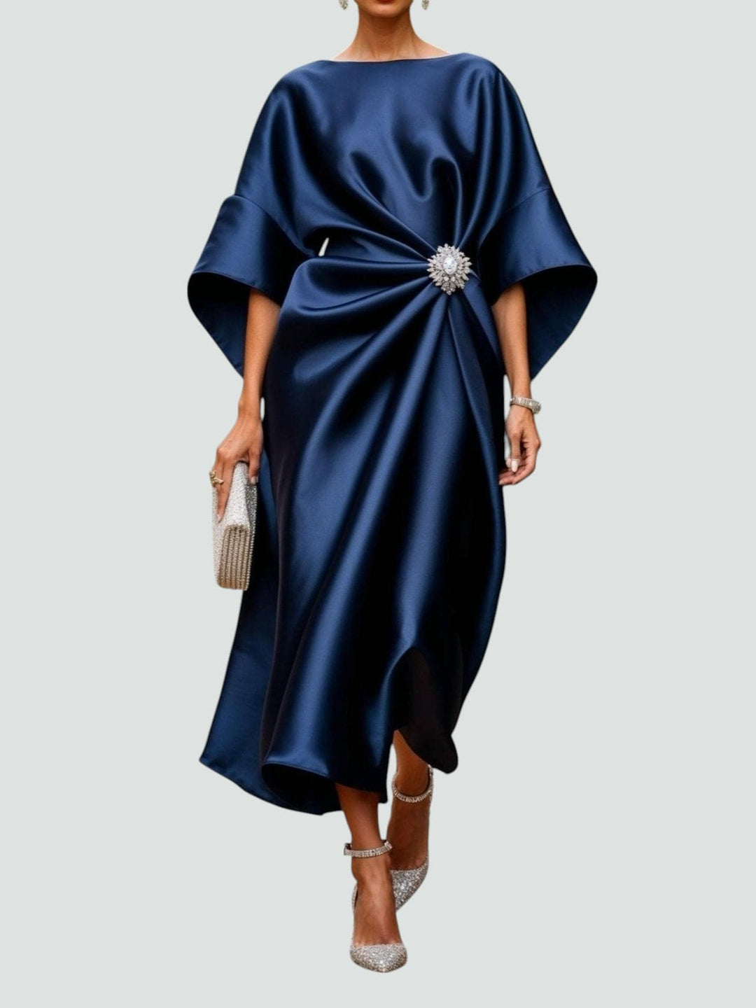 Elegant women's kimono sleeve midi dress featuring a sparkling crystal brooch, perfect for formal occasions.