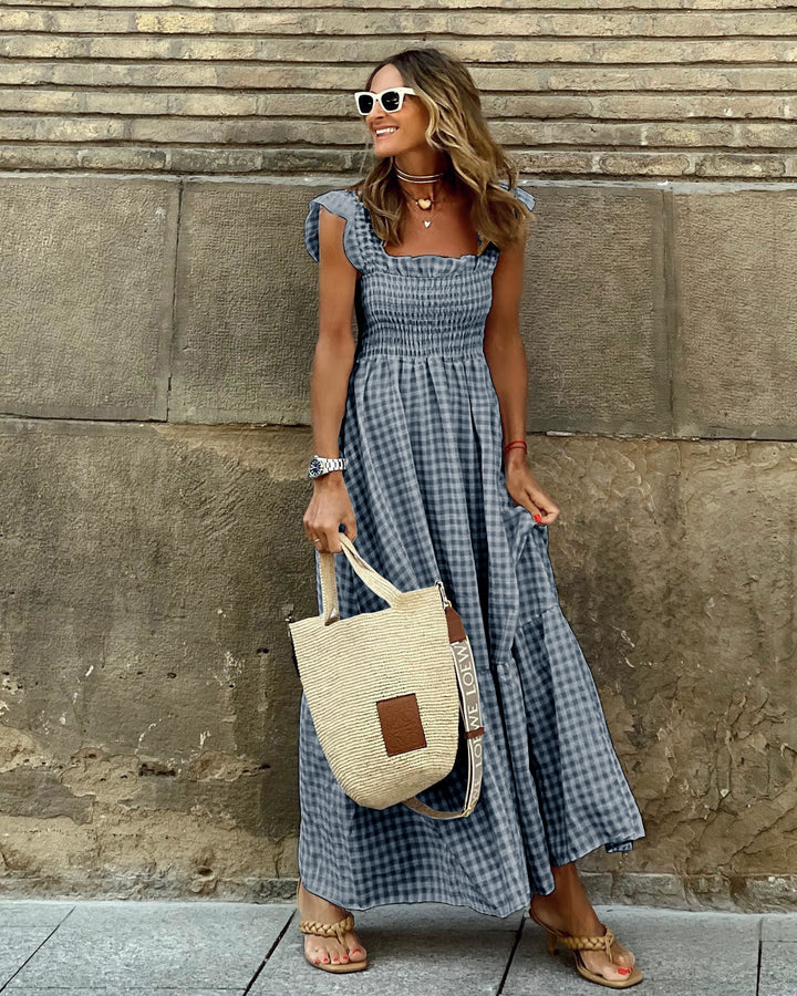 Plaid smocked maxi dress for women, featuring elegant ruffled accents. A versatile long dress for spring/summer.