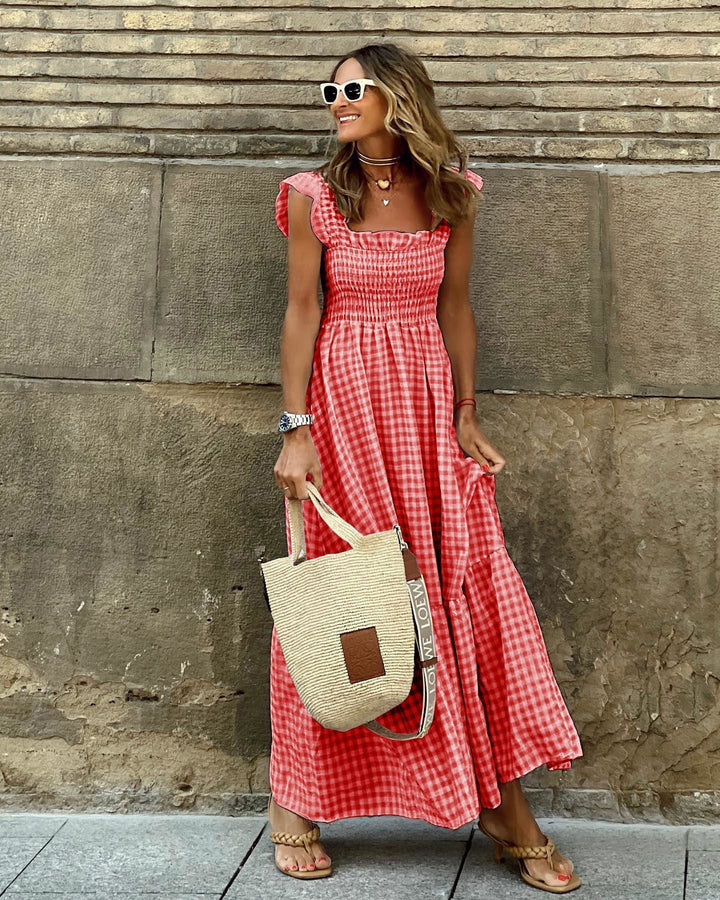 Feminine women's plaid smocked maxi dress with elegant ruffles, versatile for comfortable spring and summer days.