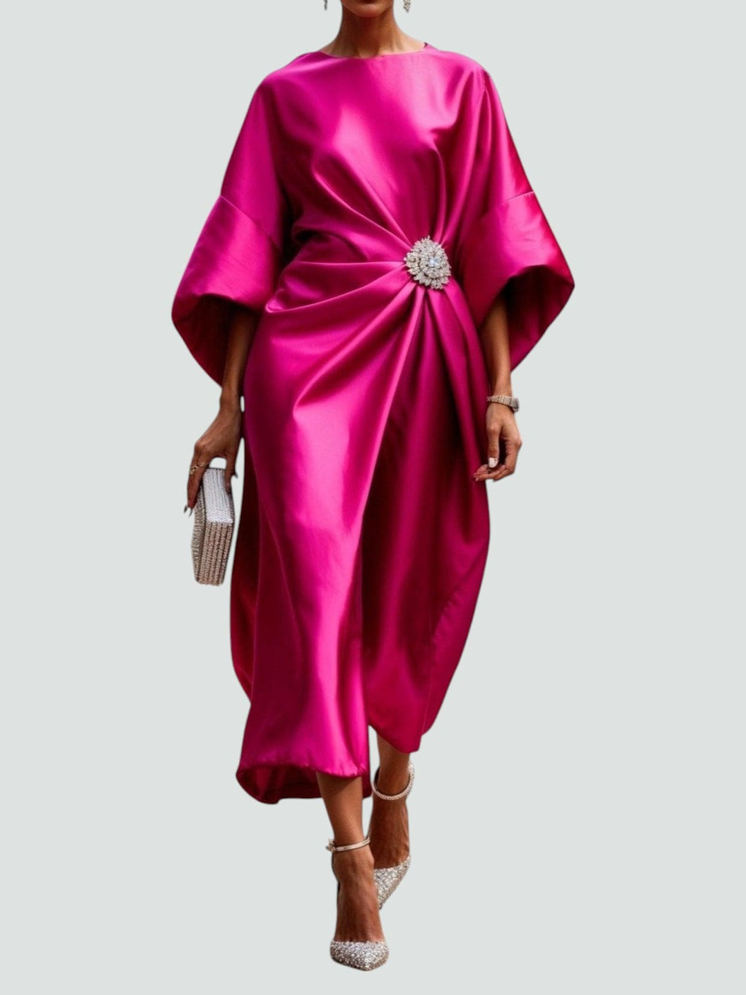 Stunning women's special occasion midi dress, designed with relaxed kimono sleeves and a beautiful crystal brooch.