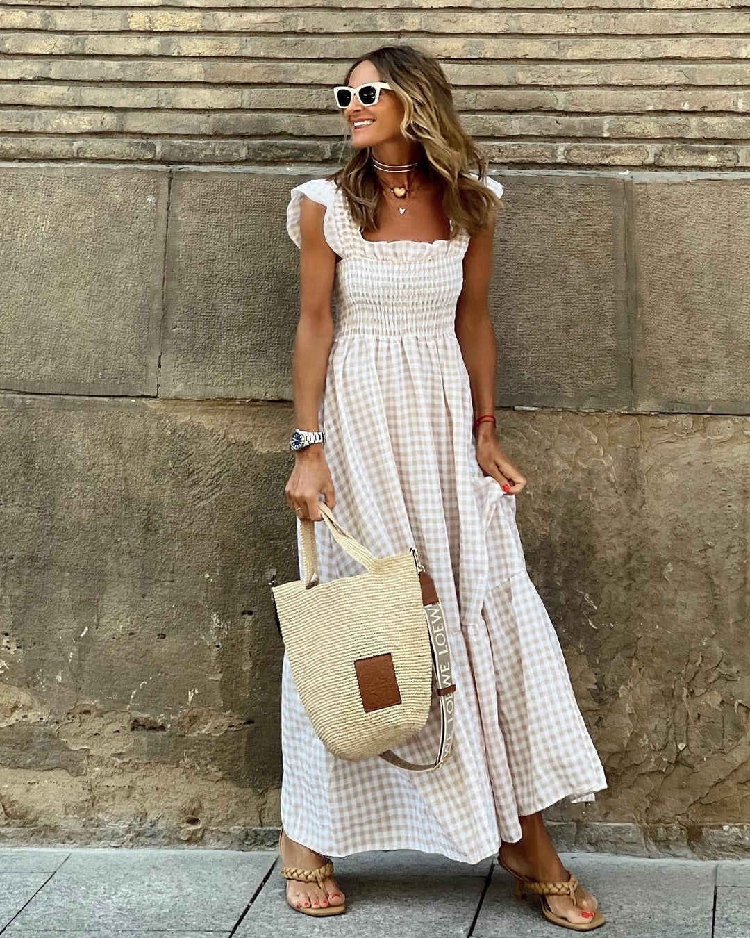 Elegant women's plaid smocked maxi dress with ruffled hem, perfect for summer & spring comfort.
