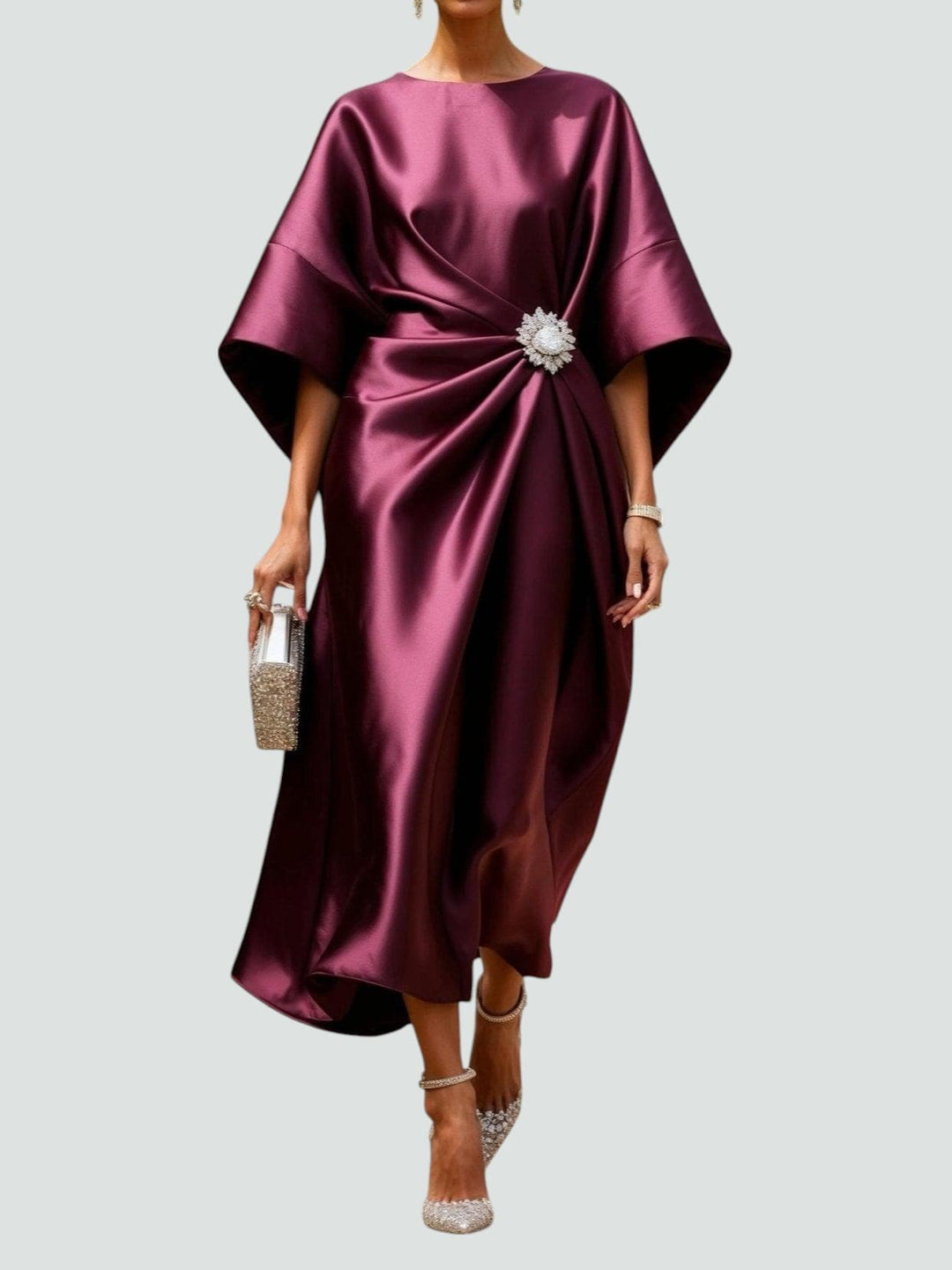 Sophisticated flowing midi dress for women, with unique kimono sleeves and a dazzling crystal brooch detail.