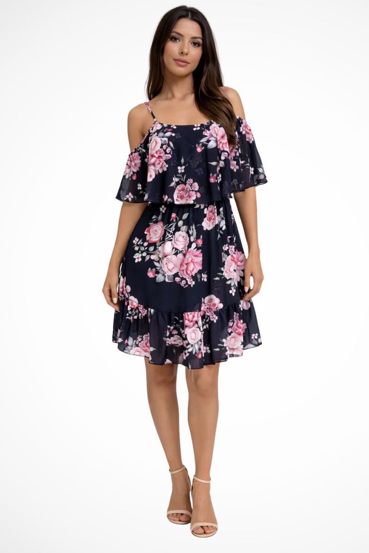 Boho-style women's floral mini dress featuring an off-shoulder neckline and delicate ruffles. Summer day dress.