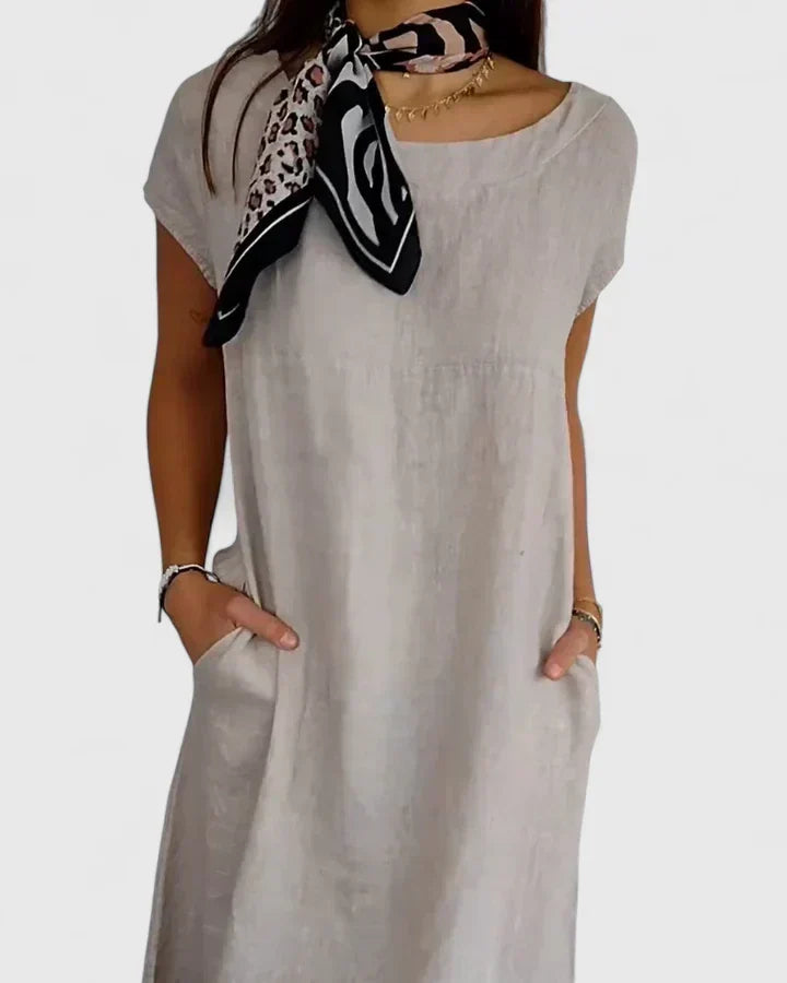 Comfortable women's A-line dress with pockets, ideal for everyday wear and casual occasions.
