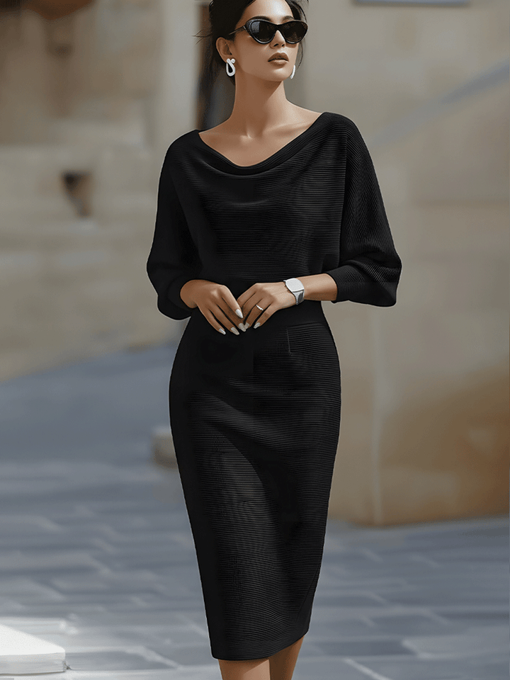 Back view of women's sophisticated draped batwing midi dress, showcasing elegant silhouette.