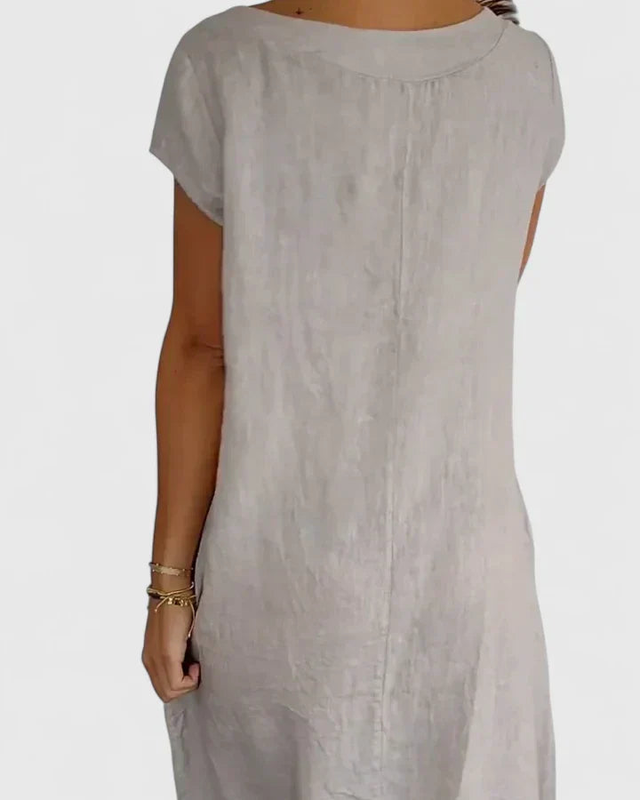 Elegant A-line women's dress with pockets, offering a comfortable and flattering fit for versatile summer fashion.