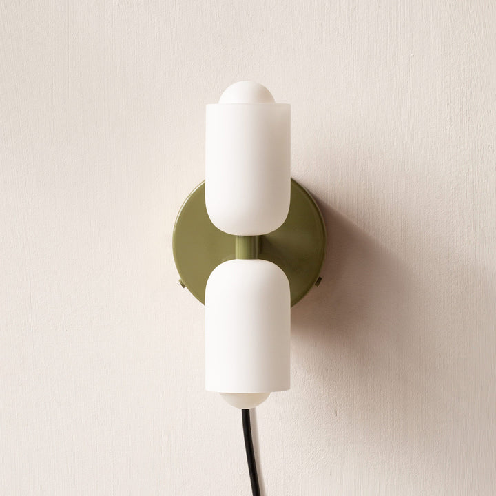Minimalist uplight downlight wall fixture, ideal for modern ambient interior lighting.