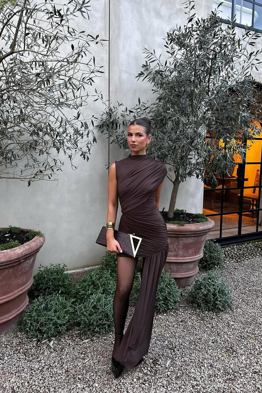 Fashionable brown draped bodycon mini dress with high neck & ruched details, perfect for a night out.