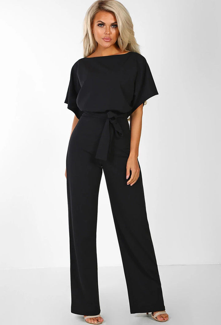 Detail of the chic tied waist on an elegant women's wide-leg jumpsuit, a key fashion highlight.
