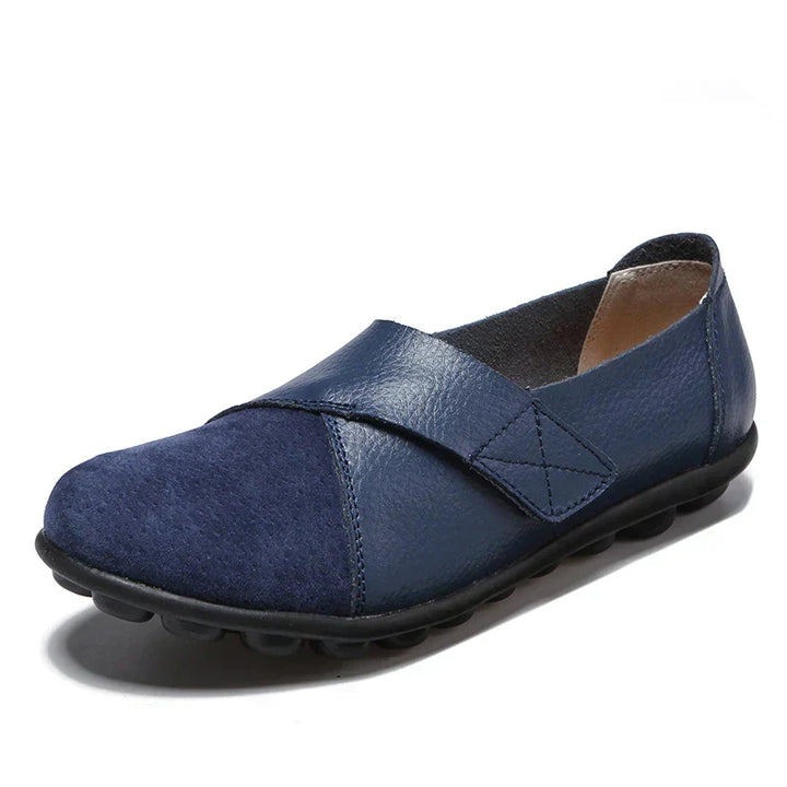 Modern unisex casual flats, round toe, slip-on, featuring intricate stitched paneled design.