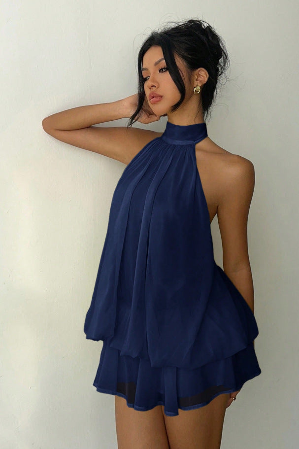 Stylish women's halter neck mini dress featuring delicate tiered ruffles; a sleeveless party essential.