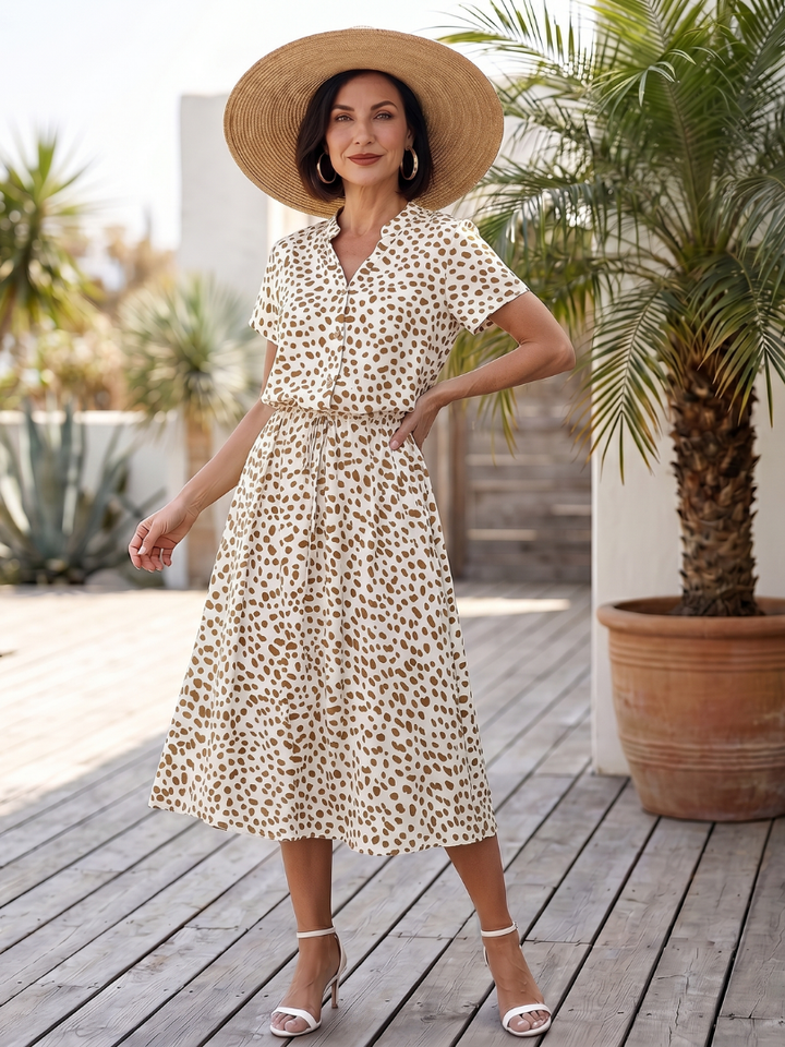 Short sleeve and classic neckline of a women's printed midi dress, offering comfort and style for summer fashion.