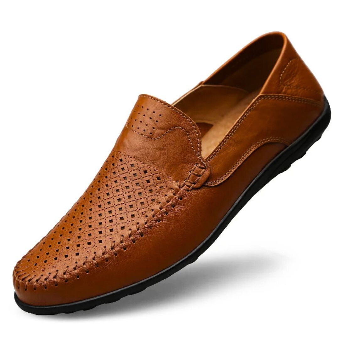 Stylish men's flat sole loafers featuring a stitched panel and perforated design, great for autumn outfits.