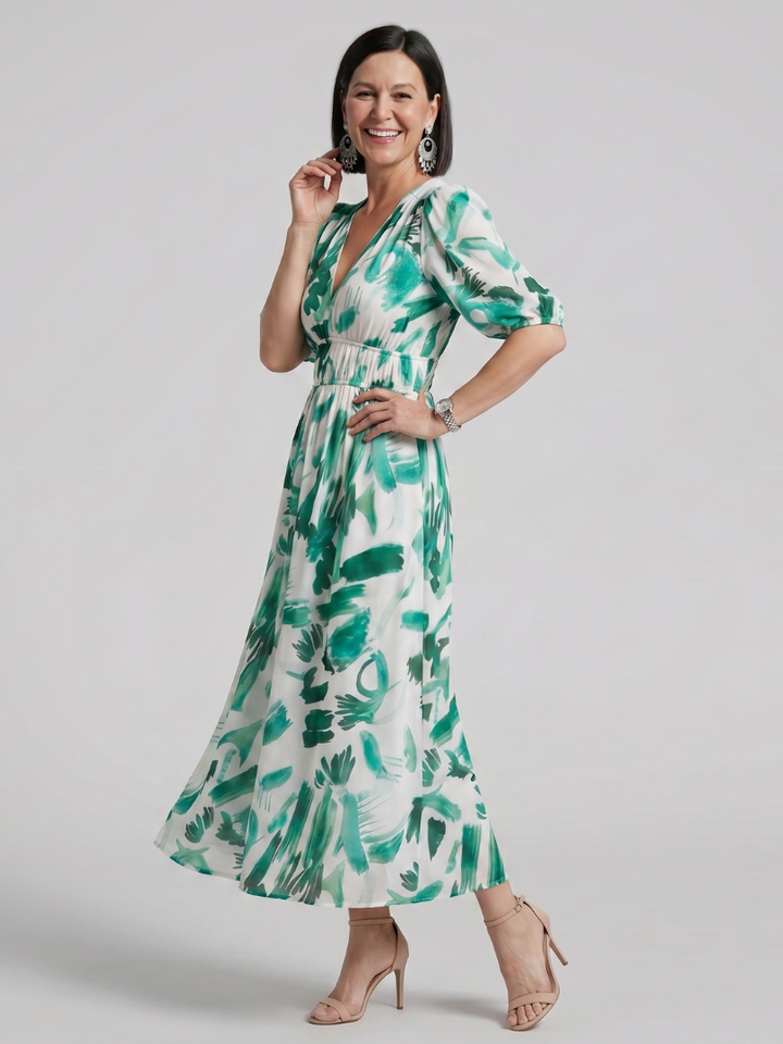 Flowy women's abstract print midi dress with puff sleeves. A comfortable and elegant V-neck summer dress choice.