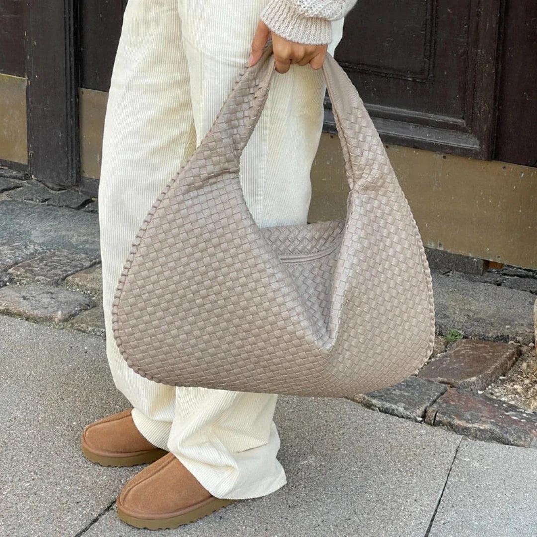 Versatile women's shoulder bag, woven vegan leather, slouchy style, fashion-forward.