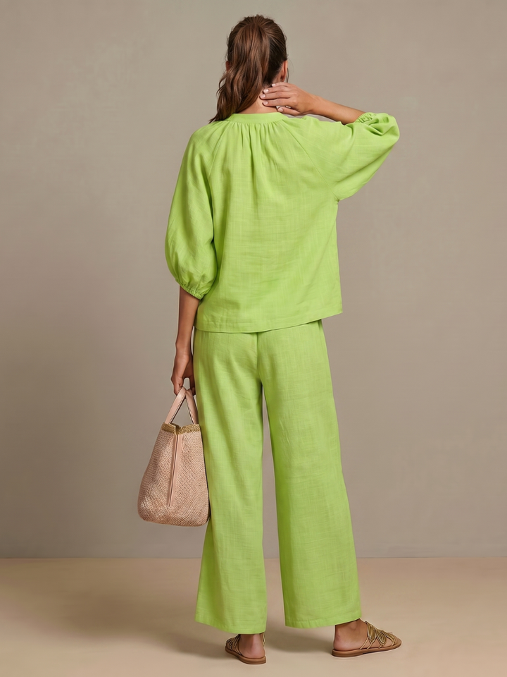 Women's two-piece outfit, casual chic. Blouson top with zip front & comfortable wide leg pants.
