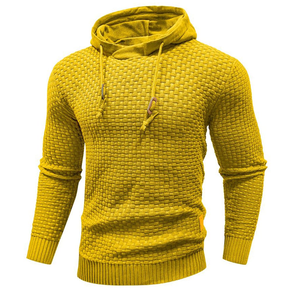 Extreme close-up of the rich waffle texture on the men's durable knit hoodie fabric.