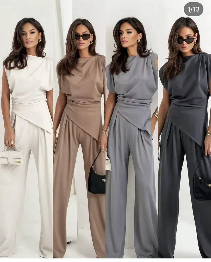 Stylish women's matching outfit: draped top and comfortable wide-leg trousers. Modern casual wear.