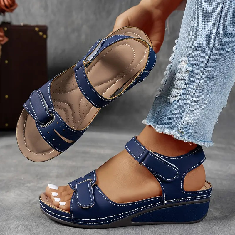 Fashionable ladies platform sandals with open toe and ankle strap, great for summer footwear.