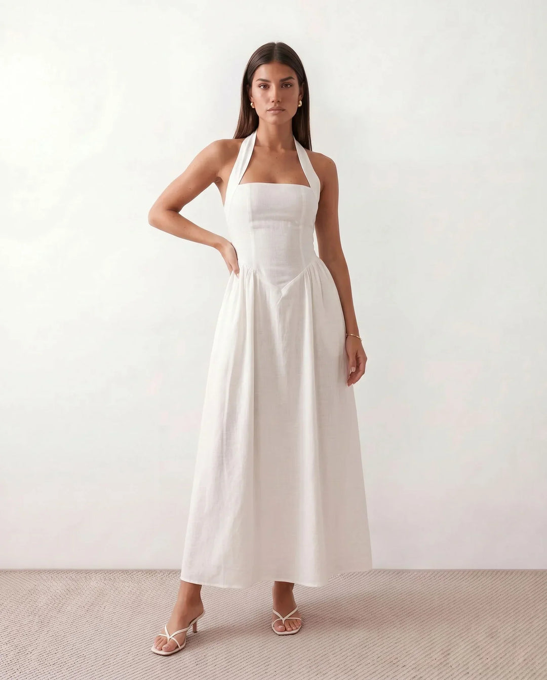 Women's Beatrix halter neck bandage maxi dress with a flattering corset-style bodice. Ideal for evening wear.