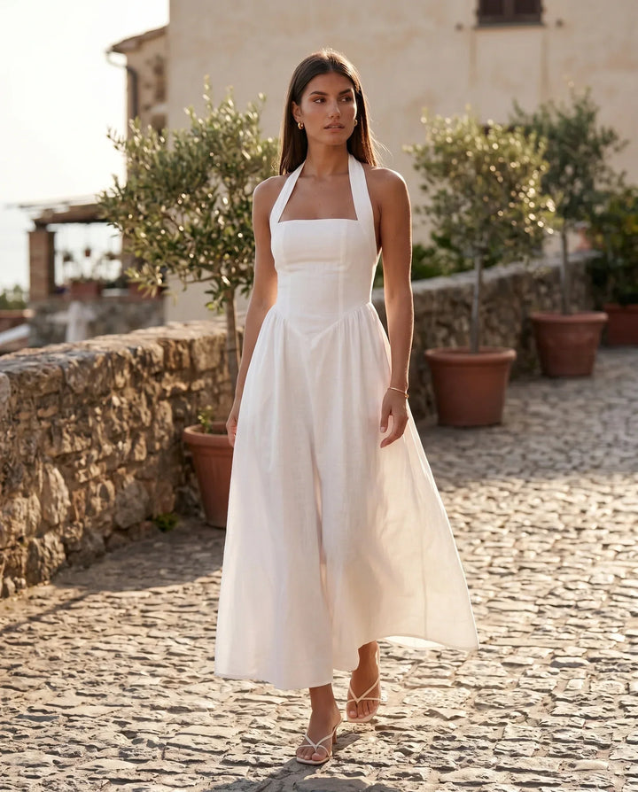 Detail of Beatrix women's elegant bandage maxi dress fabric. A-line halter evening gown texture.