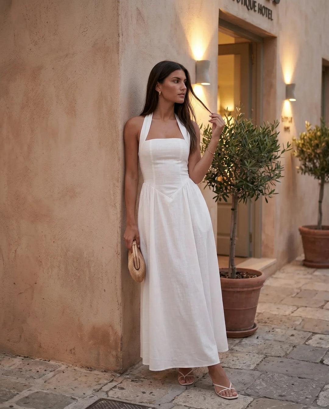 Beatrix women's A-line maxi evening dress, showing elegant halter neckline and corset detail. Formal gown.