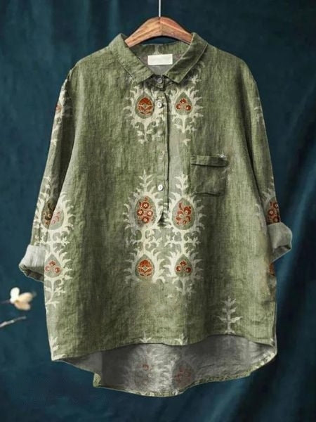 Woman in motion, wearing a flowing floral print long sleeve button-up blouse, chic & casual.