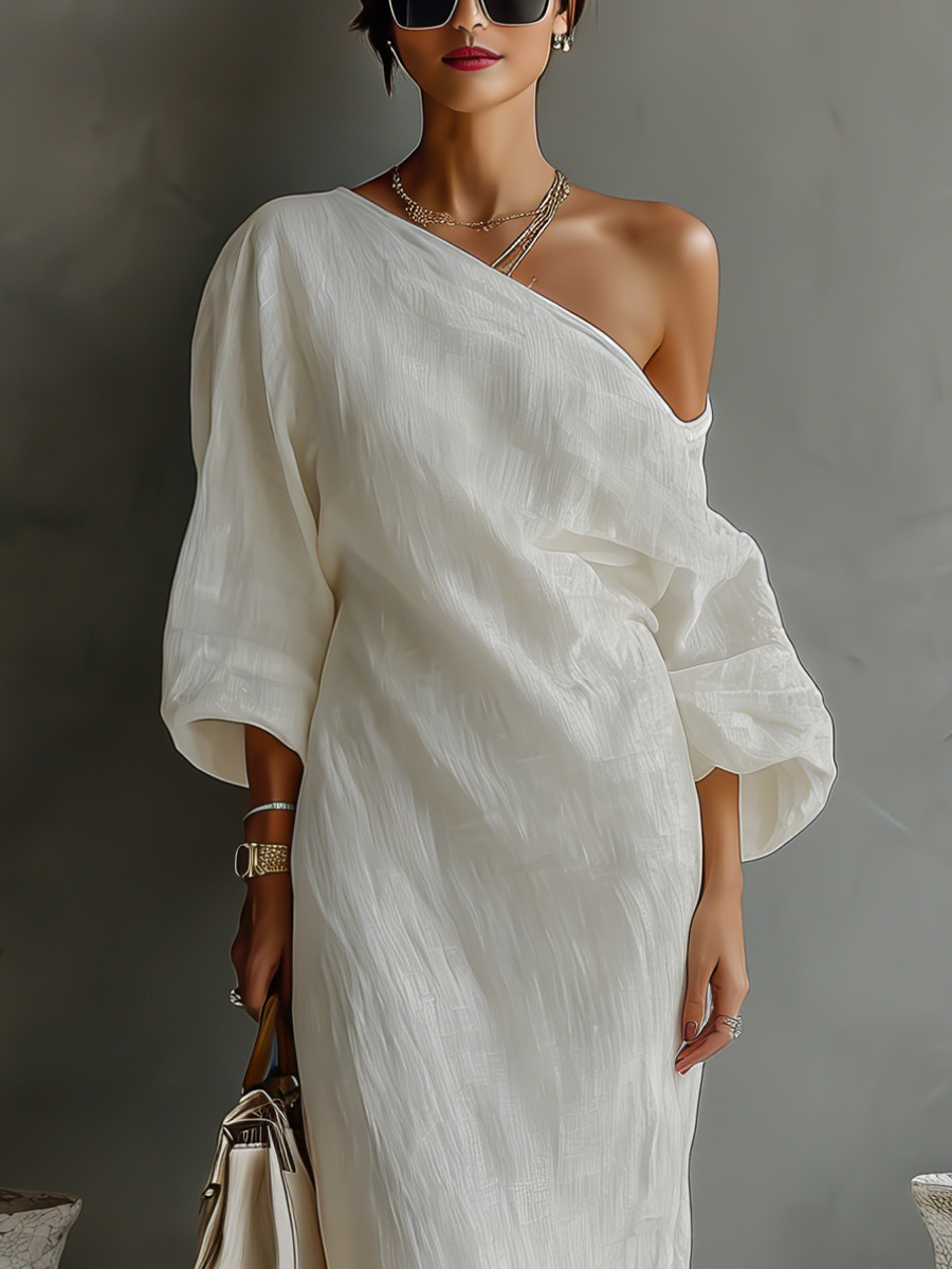 Women's elegant ivory flowing maxi dress with a stylish one-shoulder neckline. Ideal for formal & party wear.