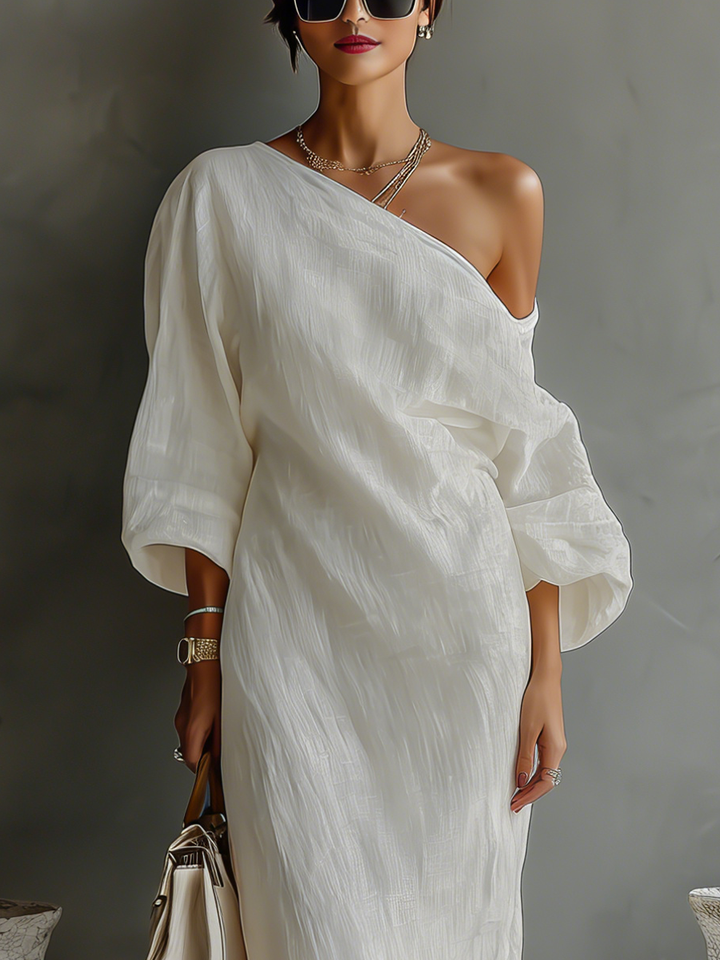 Women's elegant ivory flowing maxi dress with a stylish one-shoulder neckline. Ideal for formal & party wear.