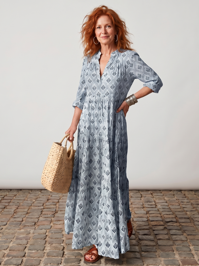 Women's long sleeve maxi dress with a sophisticated notch neck. Features a beautiful all-over print.