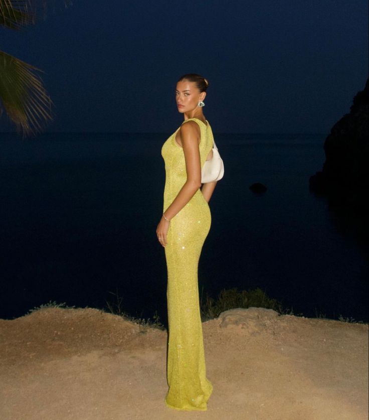 Stunning yellow shimmering maxi dress, a glamorous sleeveless evening gown perfect for women's special occasions.