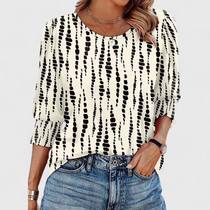 Women's elegant smocked top, a chic and comfortable blouse for spring and summer fashion.