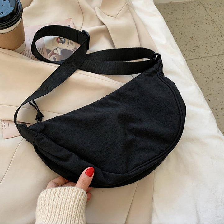 Organized Half Moon Crossbody Bag, women's ideal travel companion with spacious interior.