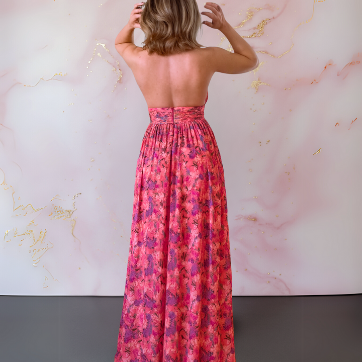 Red women's halter maxi dress with an elegant front slit, offering effortless style for summer fashion.