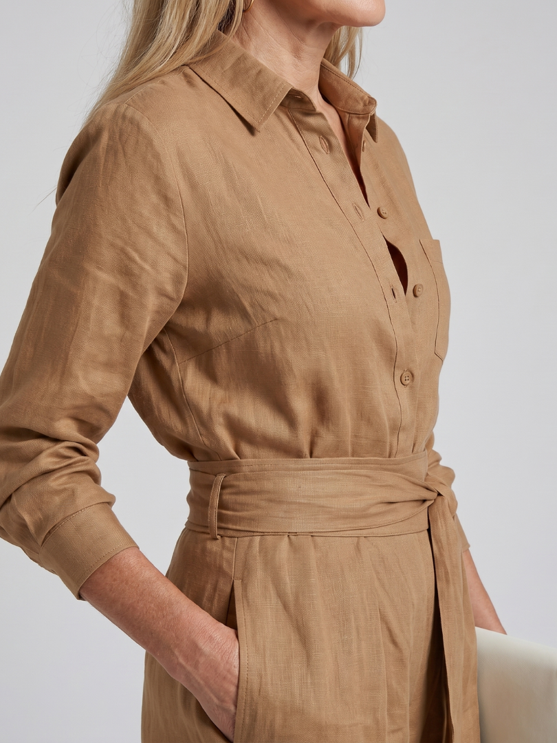 Stylish wide leg women's long sleeve jumpsuit, featuring a chic button front design.