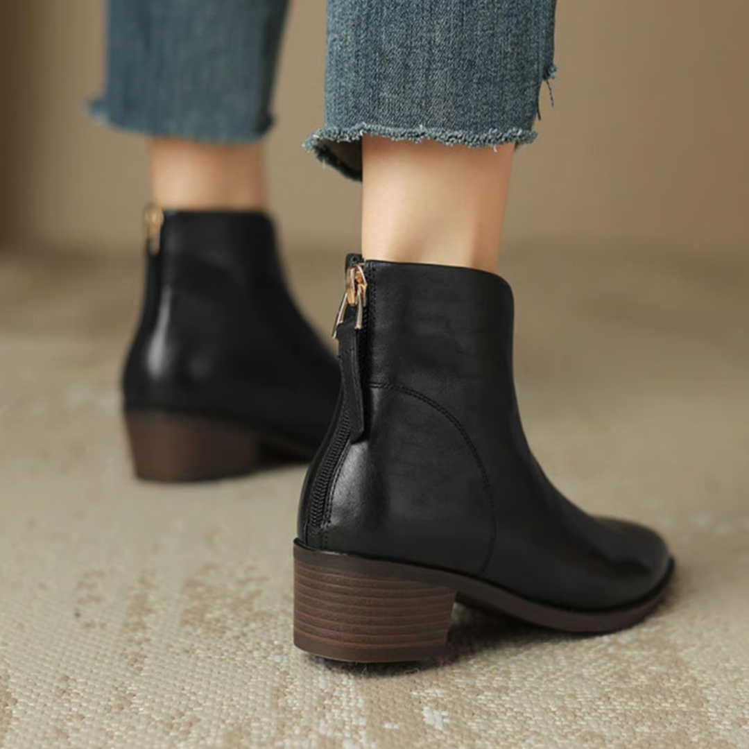 Woman wearing elegant brown ankle boots, comfortable and stylish for daily wear.
