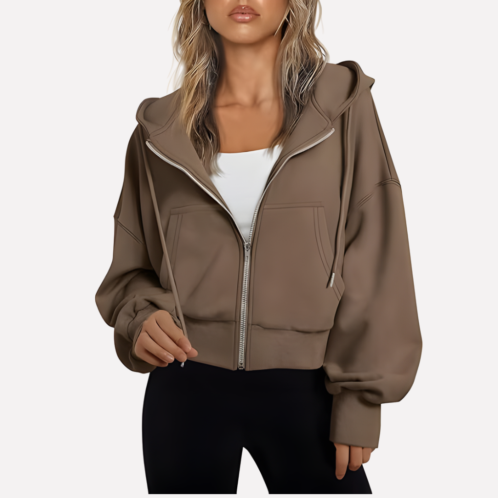 Modern women's cropped jacket, a relaxed fit zip hoodie for casual fashion.