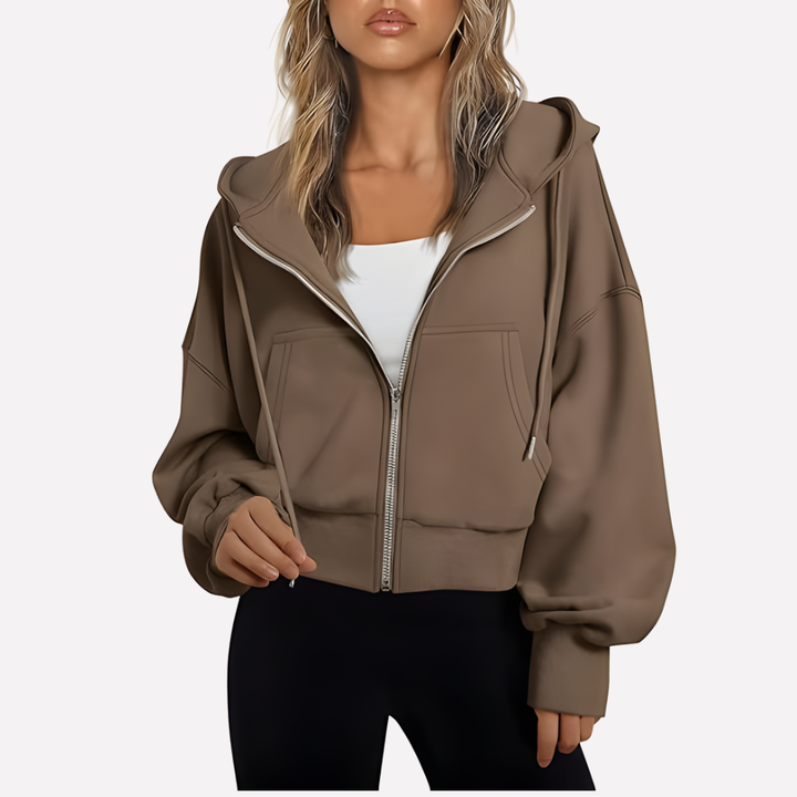 Modern women's cropped jacket, a relaxed fit zip hoodie for casual fashion.