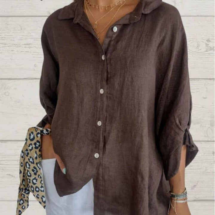 Chic women's casual long-sleeve top with loop closure. Relaxed fit shirt, great for versatile spring & summer outfits.
