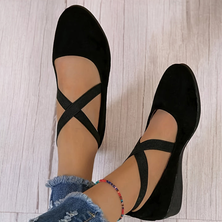 Slip-on women's fashion sandals with a low flat wedge heel, offering all-day comfort for spring & summer style.