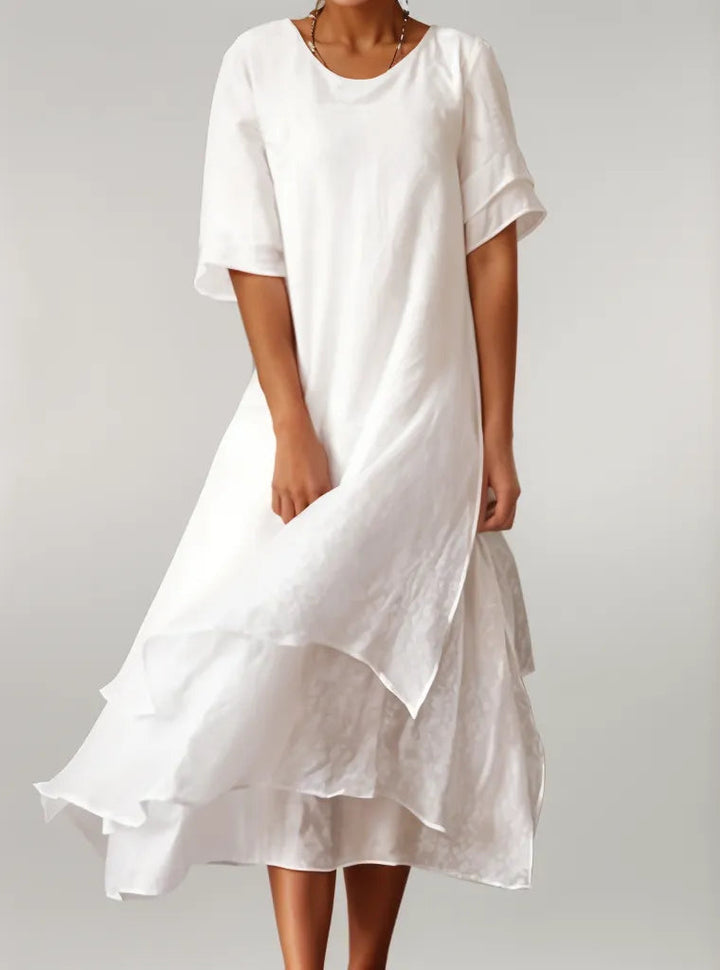 Versatile women's elegant layered midi dress, ideal for casual summer days or chic occasion wear.