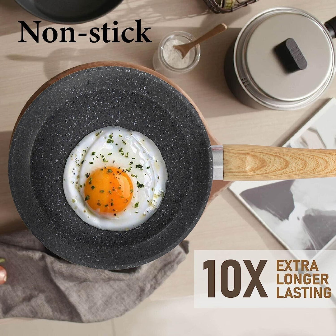 "12-piece granite coated nonstick cookware set with glass lids and ergonomic handles, perfect for versatile kitchen cooking."
