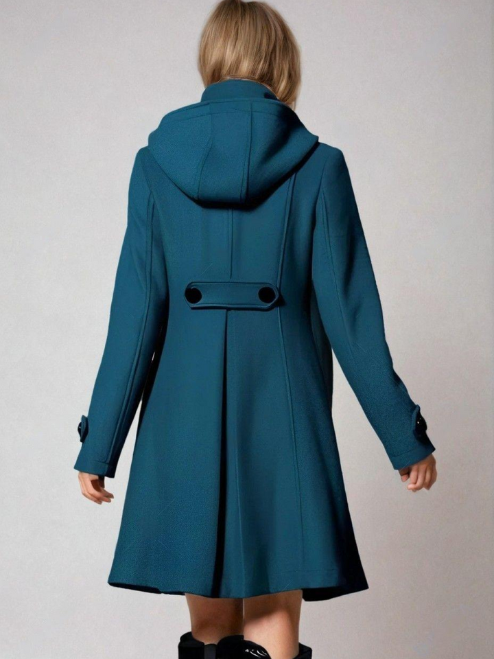 Fashionable women's A-line coat featuring an elegant funnel neck. Double-breasted design, ideal chic winter outerwear.