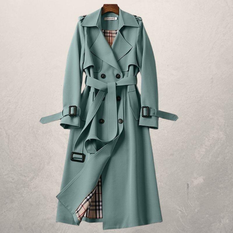Stylish women's double-breasted trench coat. Durable fabric, long silhouette for timeless fashion.
