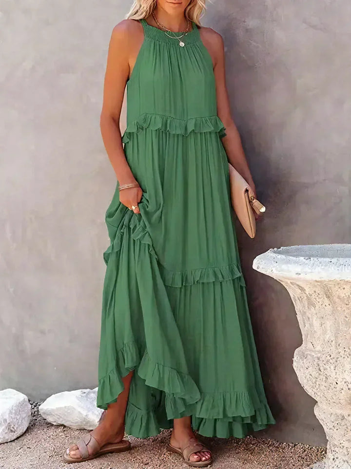 Women's summer halterneck maxi dress, effortless ruffles & practical pockets.